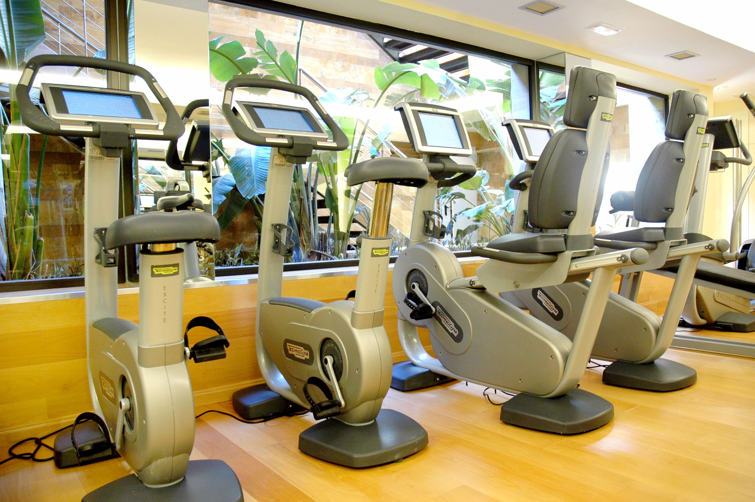 A gym with stationary bikes and exercise equipment.