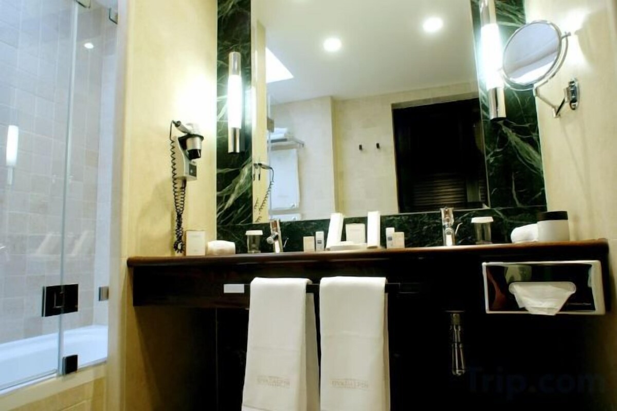 Shower, designer toiletries, hair dryer, bathrobes