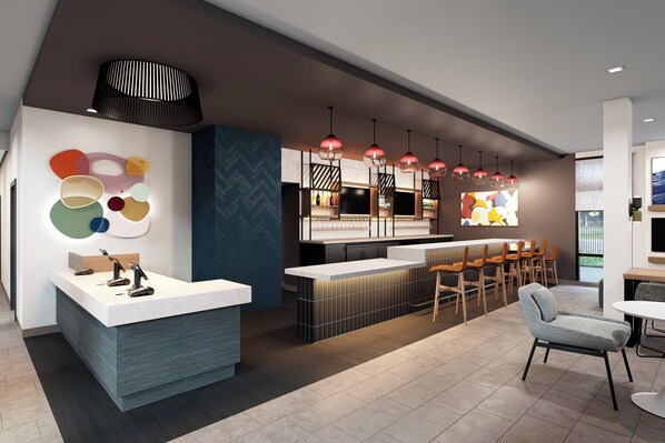 A modern bar area with a reception desk, seating, and pendant lighting. - Atwell Suites Panama City Beach Southeast by IHG (Panama City Beach)