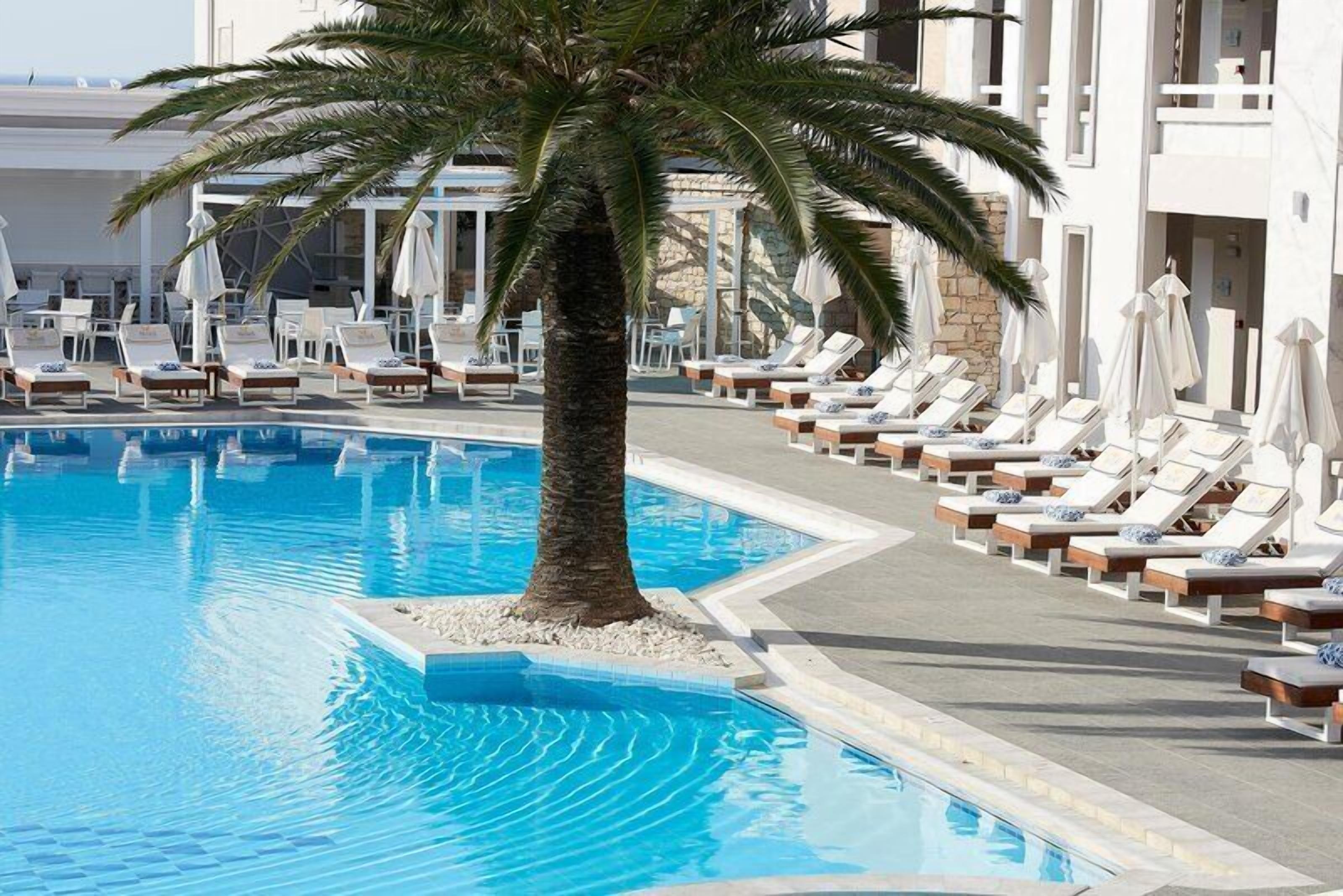 Indoor pool, seasonal outdoor pool, pool umbrellas, sun loungers