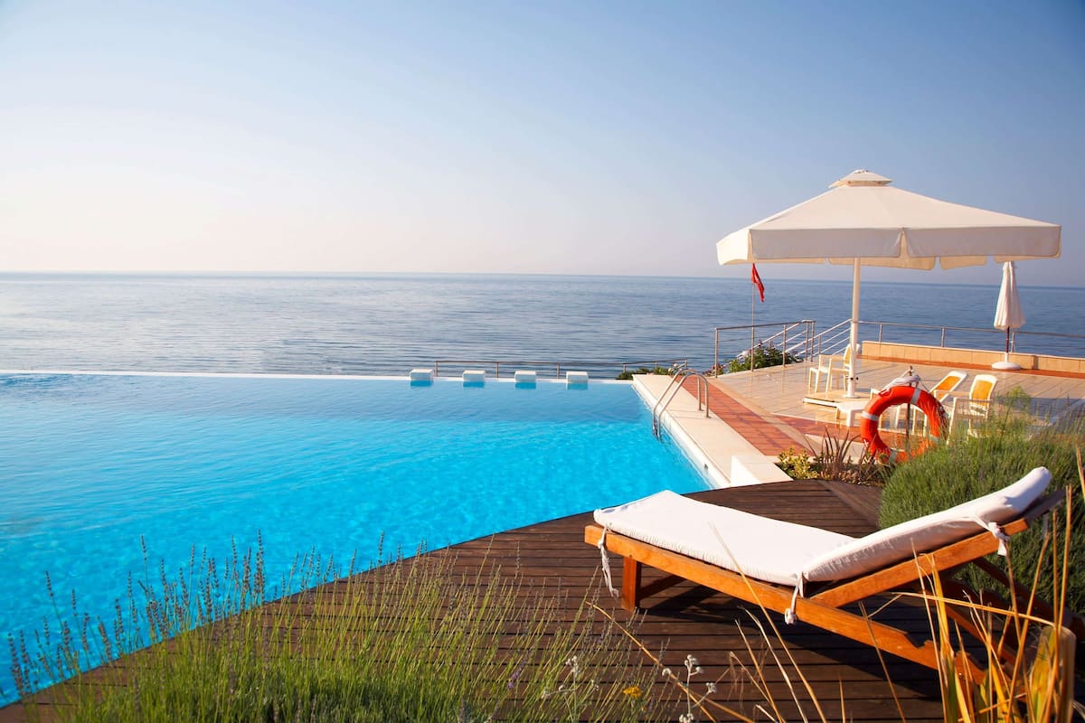 seasonal outdoor pool, pool umbrellas, pool loungers