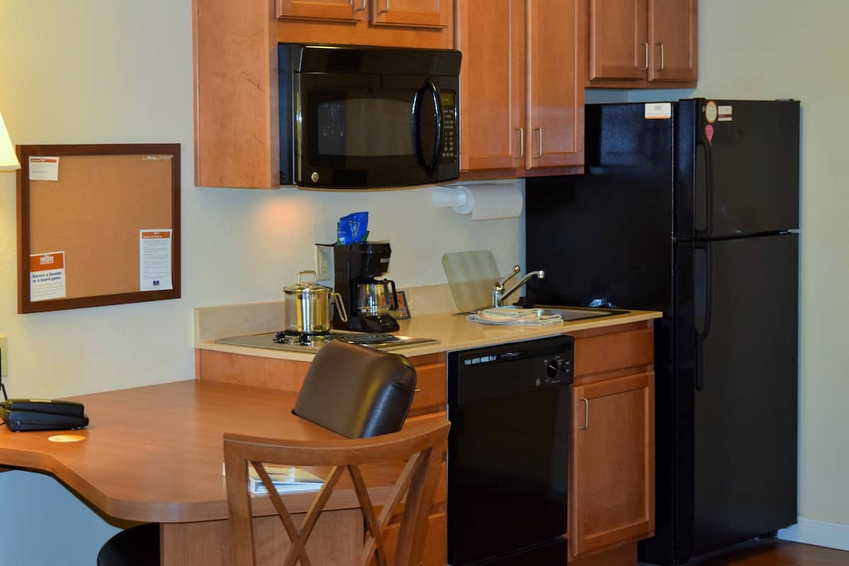 fridge, microwave, coffee/tea maker, cookware/dishes/utensils