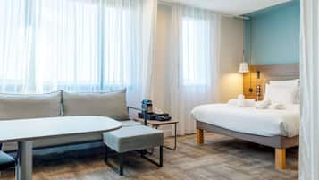 Suite Exécutive, 1 trÚs grand lit | Minibar, coffres-forts dans les chambres, bureau, rideaux occultants