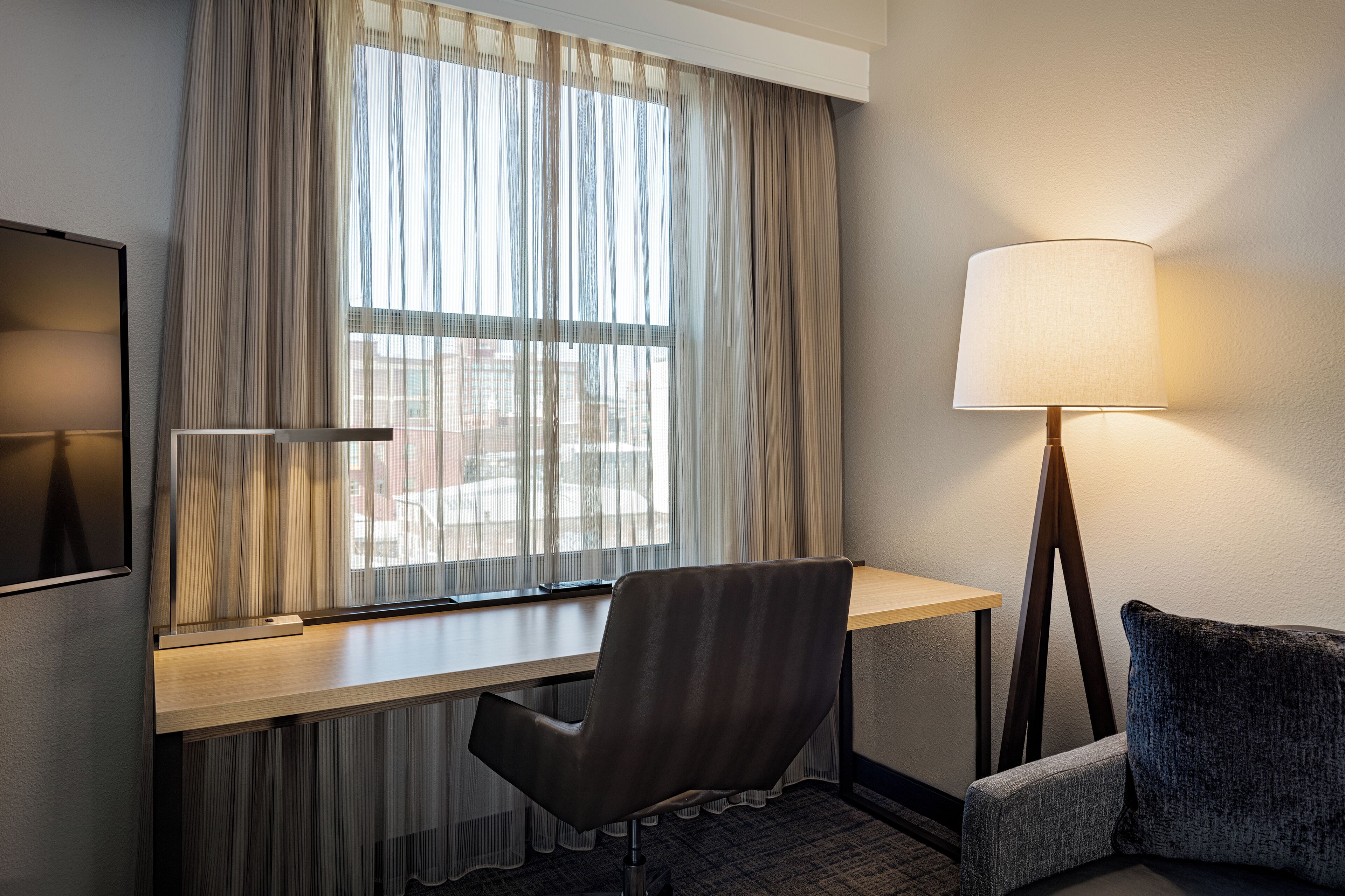 premium bedding, desk, laptop workspace, blackout curtains