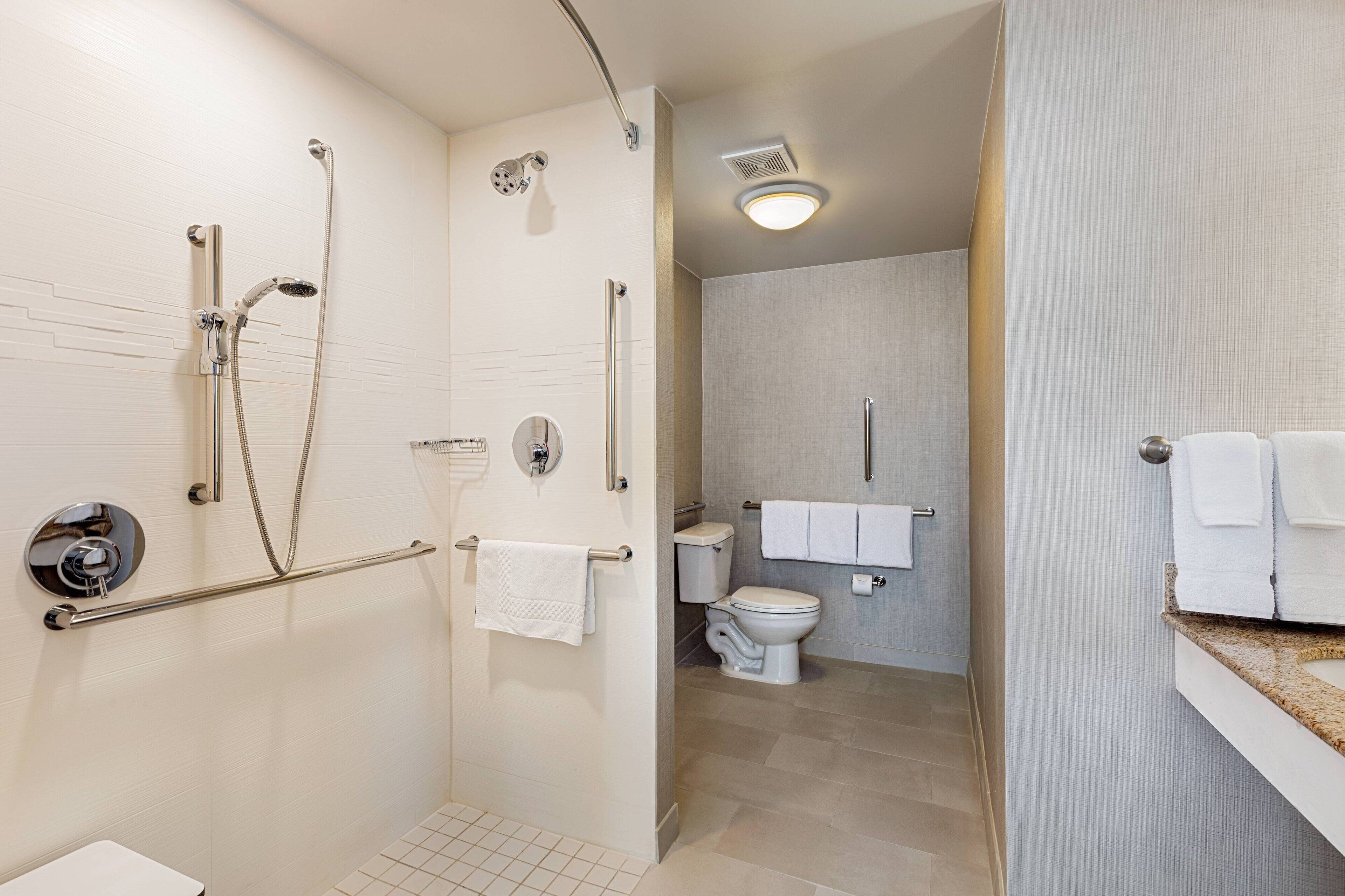 room, 1 bedroom, non smoking (mobility/hearing access, roll-in shwr) | bathroom | combined shower/bathtub, free toiletries, hair dryer, towels