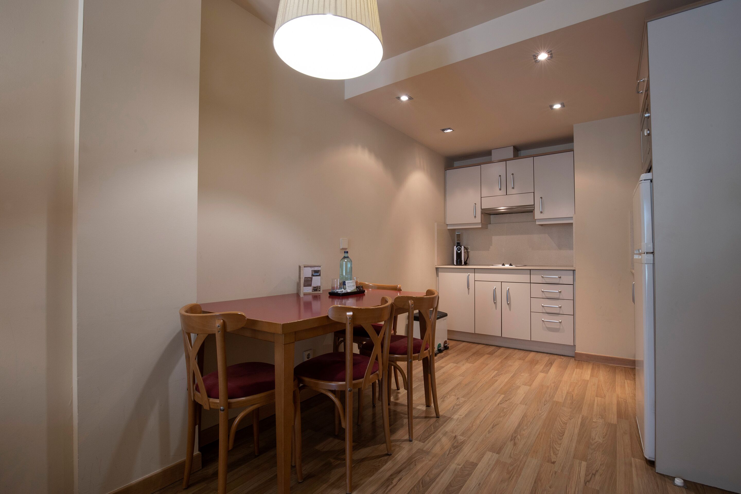 full-sized fridge, microwave, stovetop, coffee/tea maker