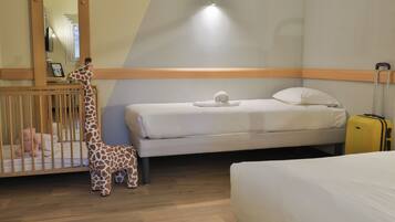 Family Room | Premium bedding, desk, blackout drapes, soundproofing