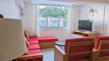 Superior Apartment | Living area | Flat-screen TV
