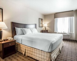 Desk, laptop workspace, blackout drapes, iron/ironing board