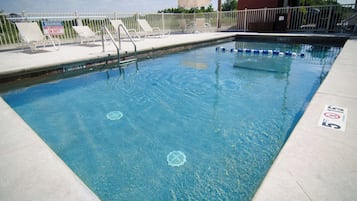 Seasonal outdoor pool, open 10:00 AM to 10:00 PM, pool umbrellas