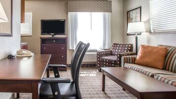 Desk, laptop workspace, blackout drapes, iron/ironing board