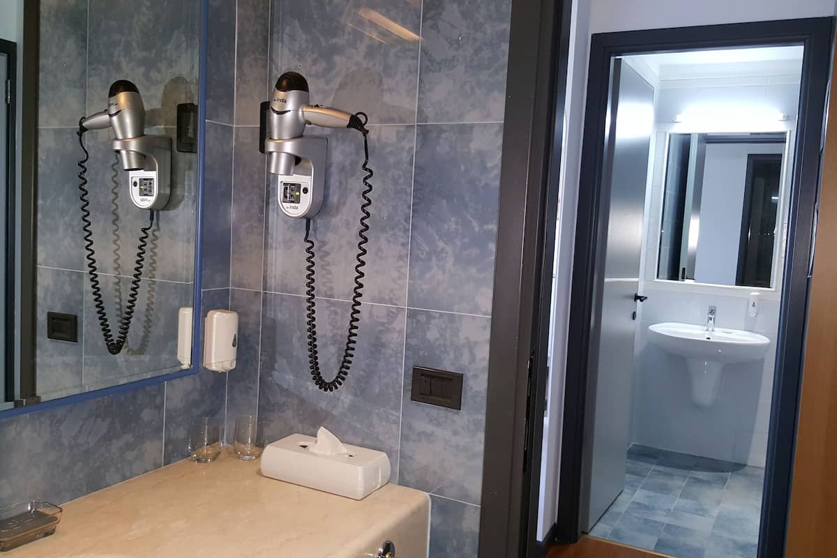 junior triple room, 2 bathrooms, hill view | bathroom | combined shower/bathtub, deep-soaking bathtub, hair dryer, slippers