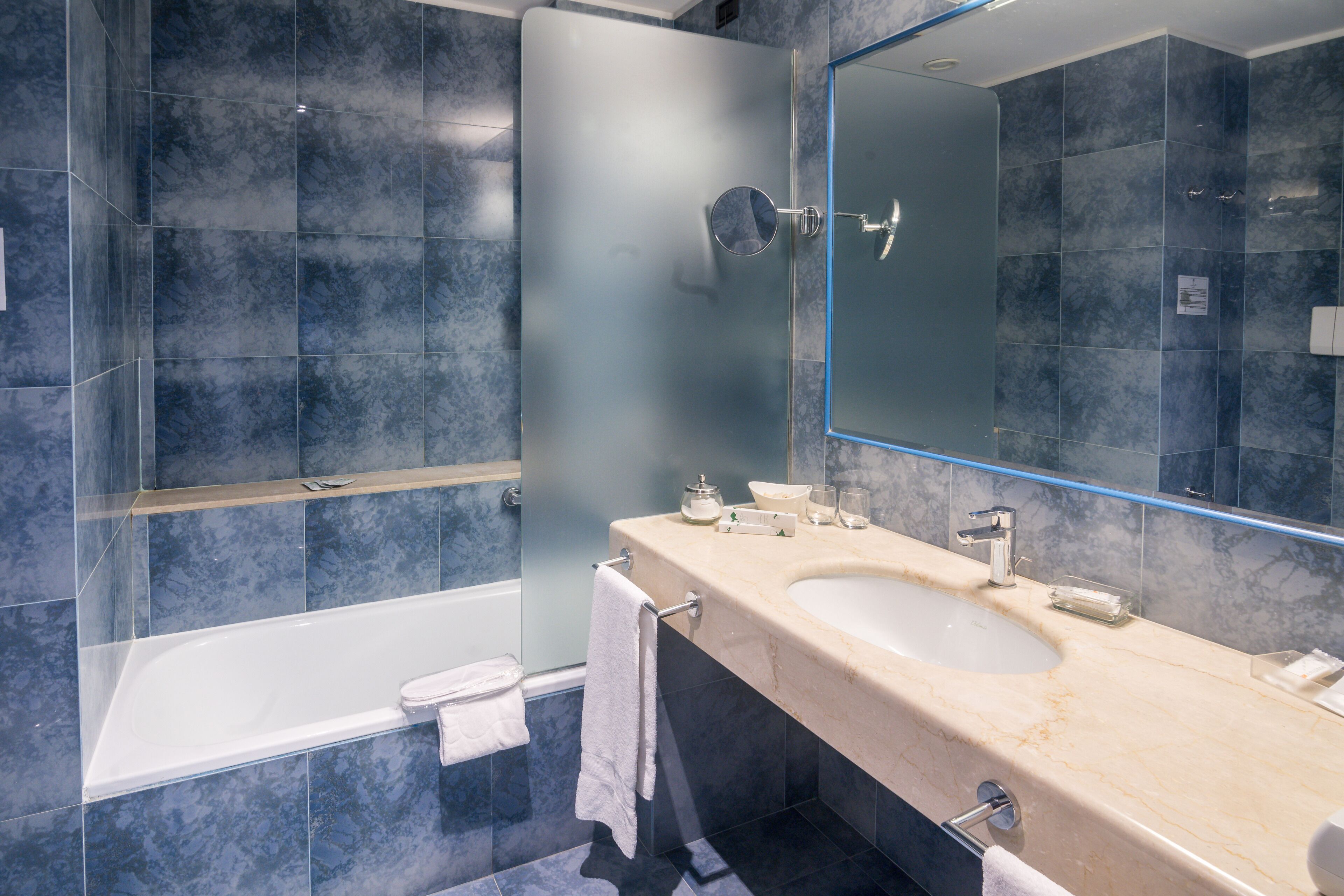 combined shower/bathtub, deep-soaking bathtub, hair dryer, slippers