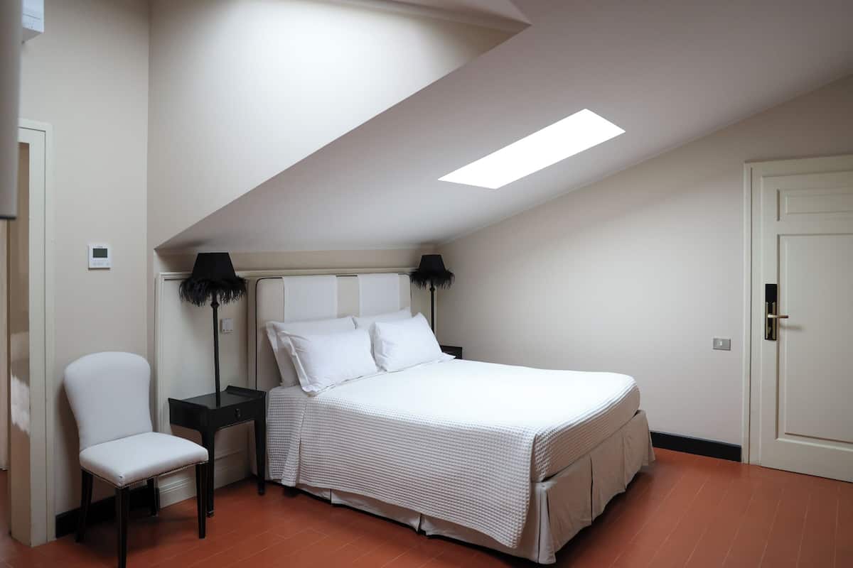 Suite familiar, vistes al jardí | 1 dormitori, roba de llit hipoal·lergògena i minibar