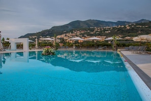 Outdoor pool, pool umbrellas, sun loungers