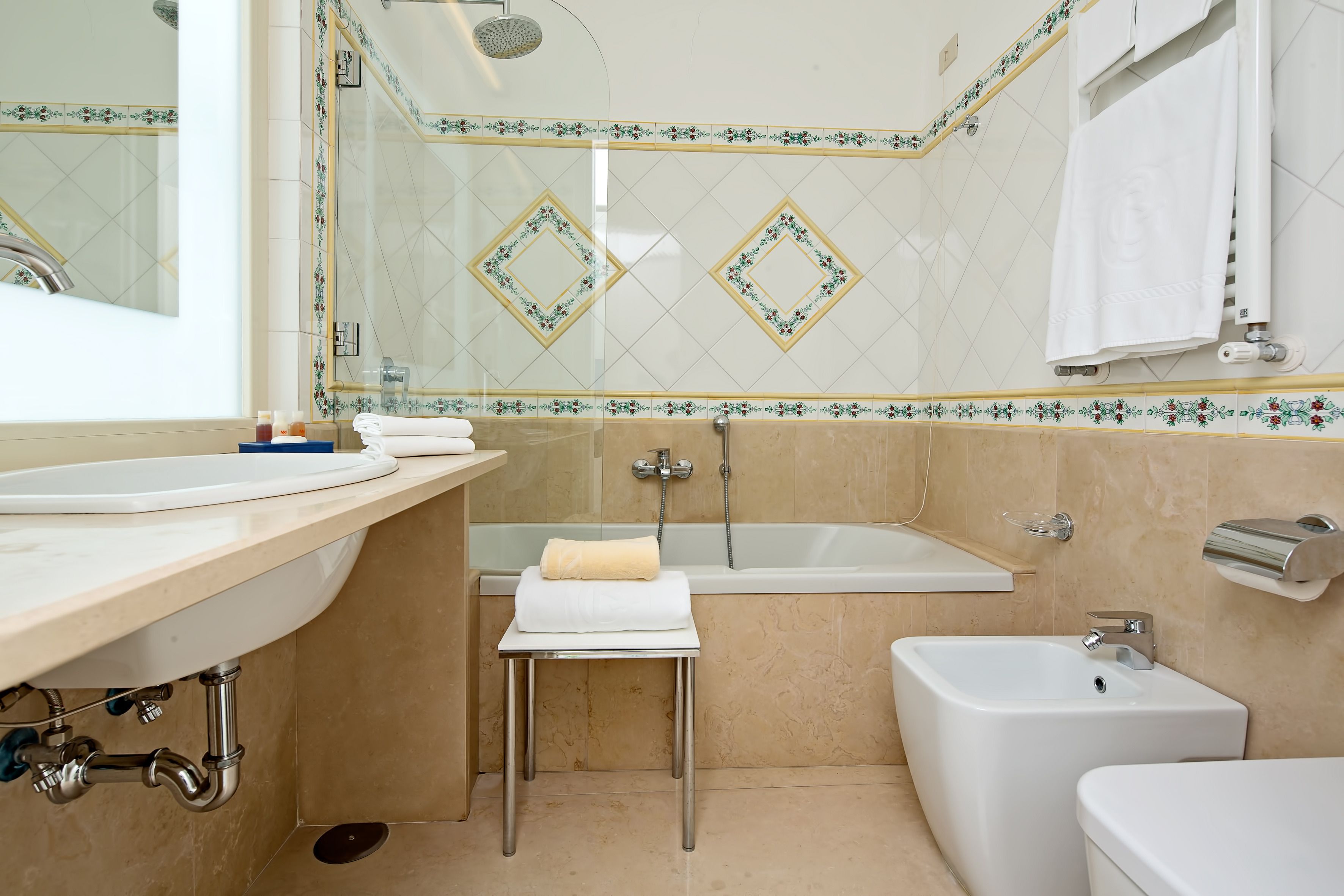 combined shower/bathtub, free toiletries, hair dryer, slippers