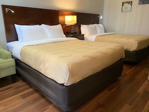 Desk, laptop workspace, bed sheets