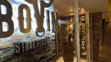 Welcome to Boy's Steak House, where a rustic-chic facade gives way to an upscale dining experience.