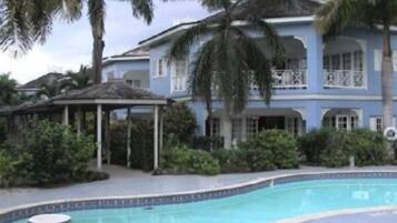 Outdoor pool, open 9:00 AM to 5:00 PM, pool umbrellas, pool loungers