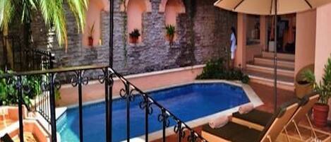 Outdoor pool, pool umbrellas, pool loungers