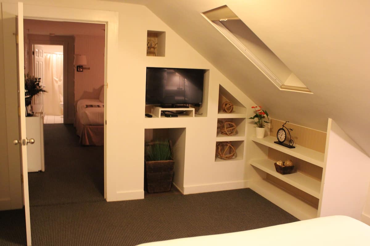 Suite, 2 Bedrooms | Down comforters, individually decorated, blackout drapes