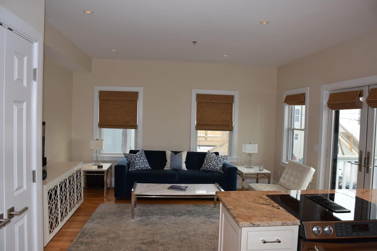 luxury condo, 1 queen bed, kitchen, bay view | living area | 52-inch flat-screen tv with cable channels, tv, streaming services