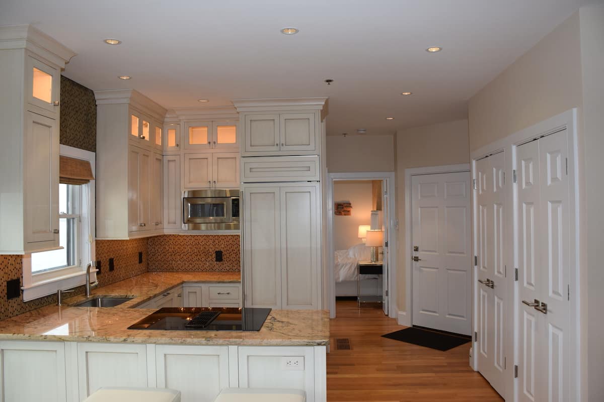 luxury condo, 1 queen bed, kitchen, bay view | 1 bedroom, down duvets, individually decorated, blackout curtains