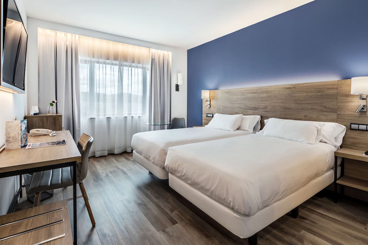 premium bedding, down duvets, minibar, in-room safe