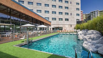Seasonal outdoor pool, open 10:30 AM to 8:30 PM, pool umbrellas