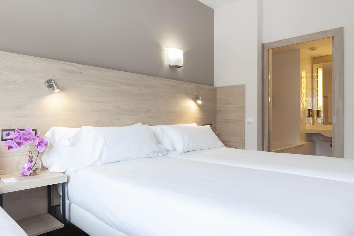 premium bedding, down duvets, minibar, in-room safe