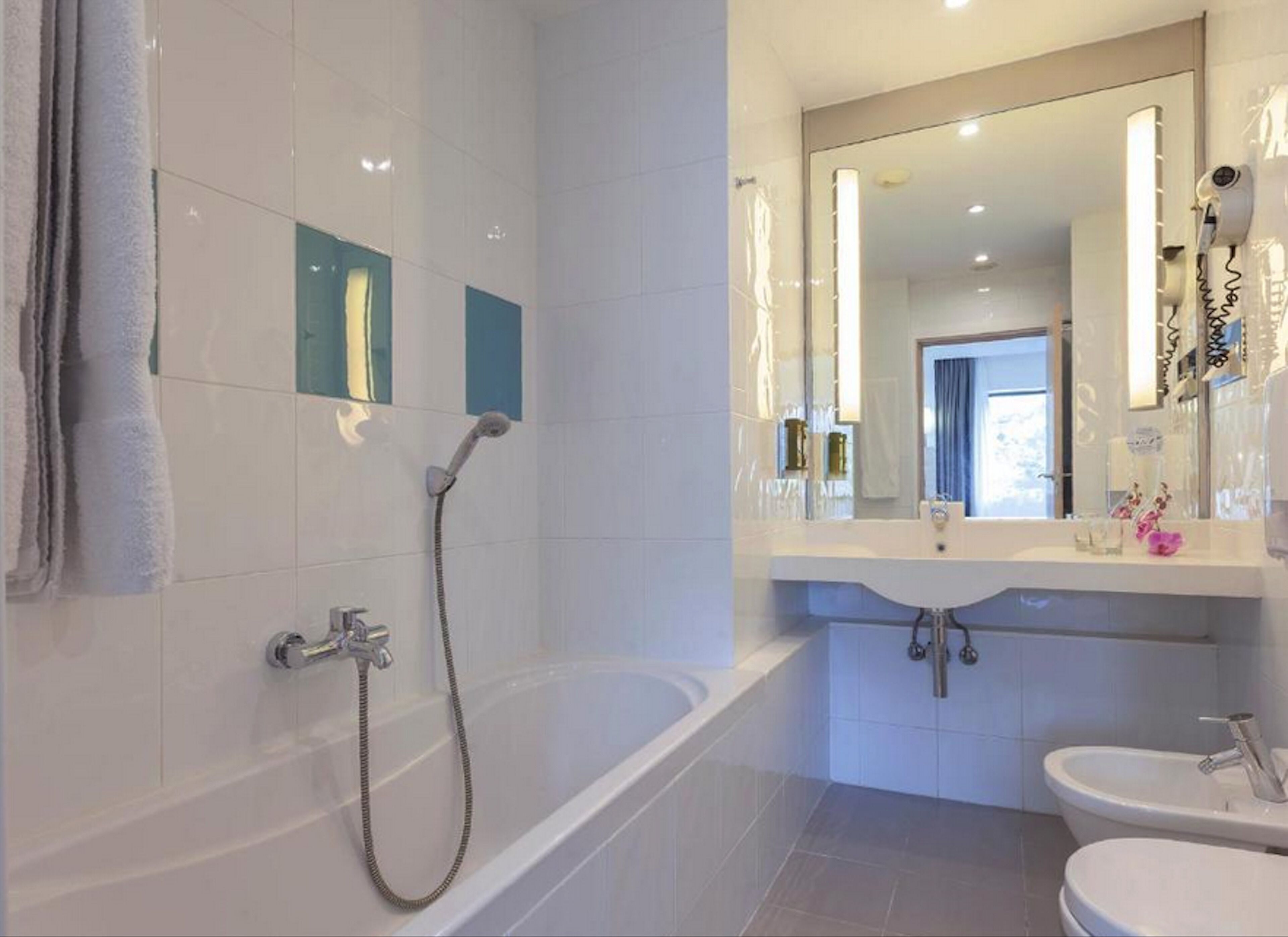 separate bathtub and shower, free toiletries, hair dryer, bidet