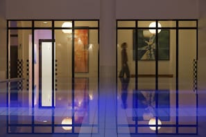 Indoor pool, open 8:00 AM to 9:00 PM, pool loungers