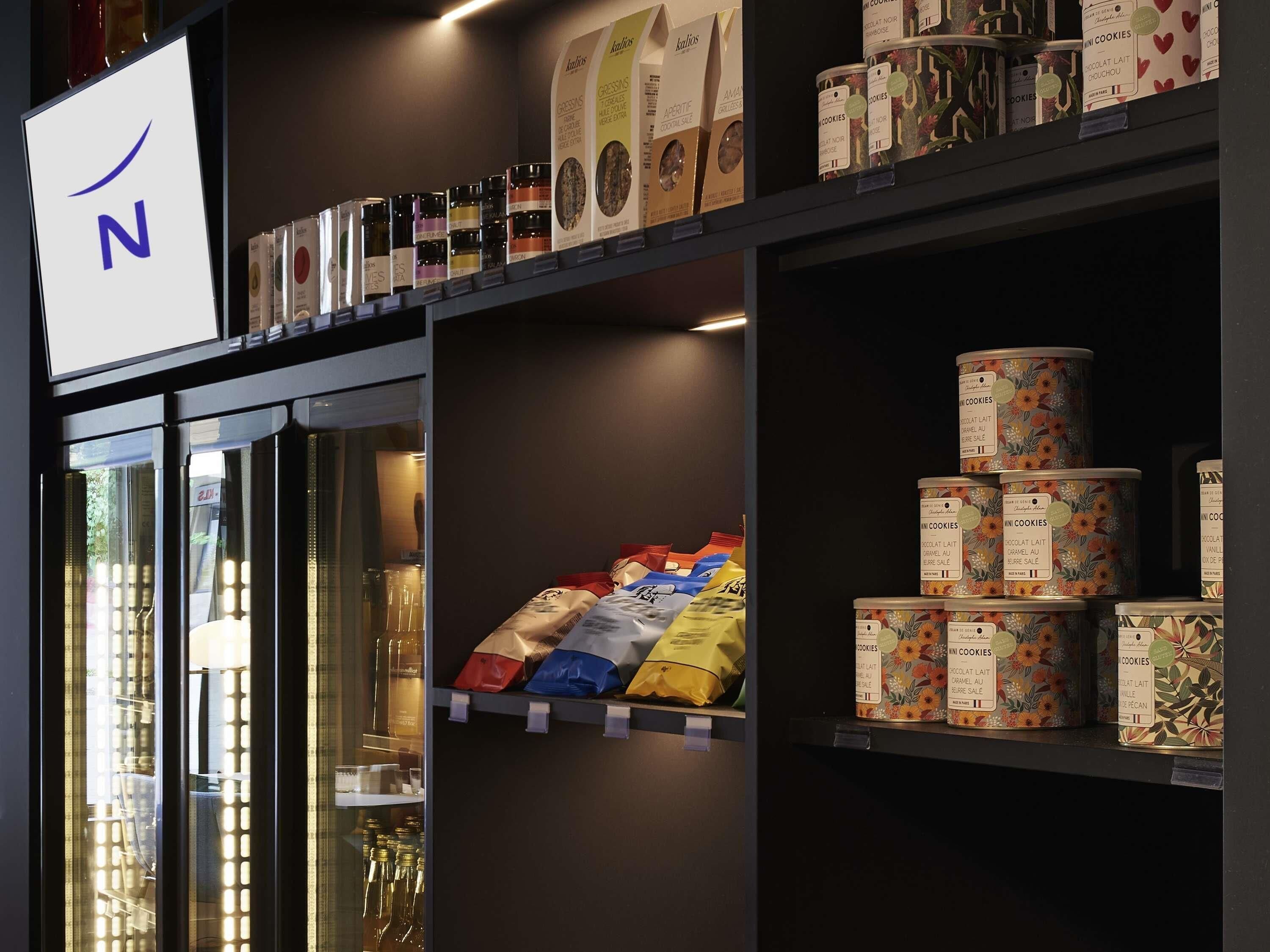 A store interior with shelves stocked with various packaged goods, including cookies and other items.