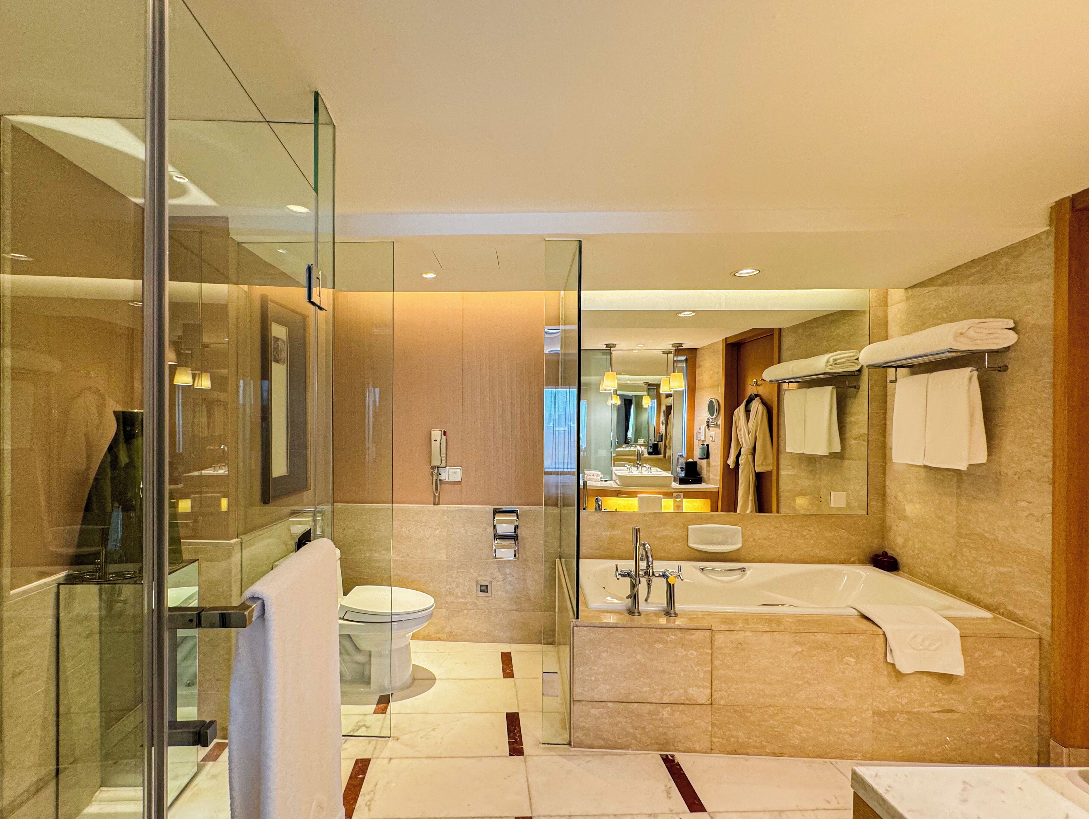 separate bathtub and shower, deep-soaking bathtub, designer toiletries
