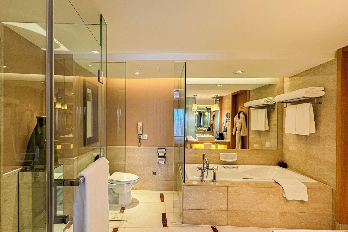 separate bathtub and shower, deep-soaking bathtub, designer toiletries
