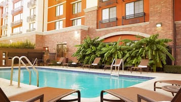 Outdoor pool, open 9:00 AM to 10:00 PM, pool umbrellas