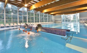 3 indoor pools, outdoor pool, open 10 AM to 7 PM, pool umbrellas