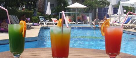 Seasonal outdoor pool, open 10 AM to 7 PM, pool umbrellas, pool loungers