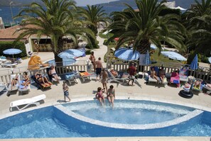 Seasonal outdoor pool, pool umbrellas, sun loungers