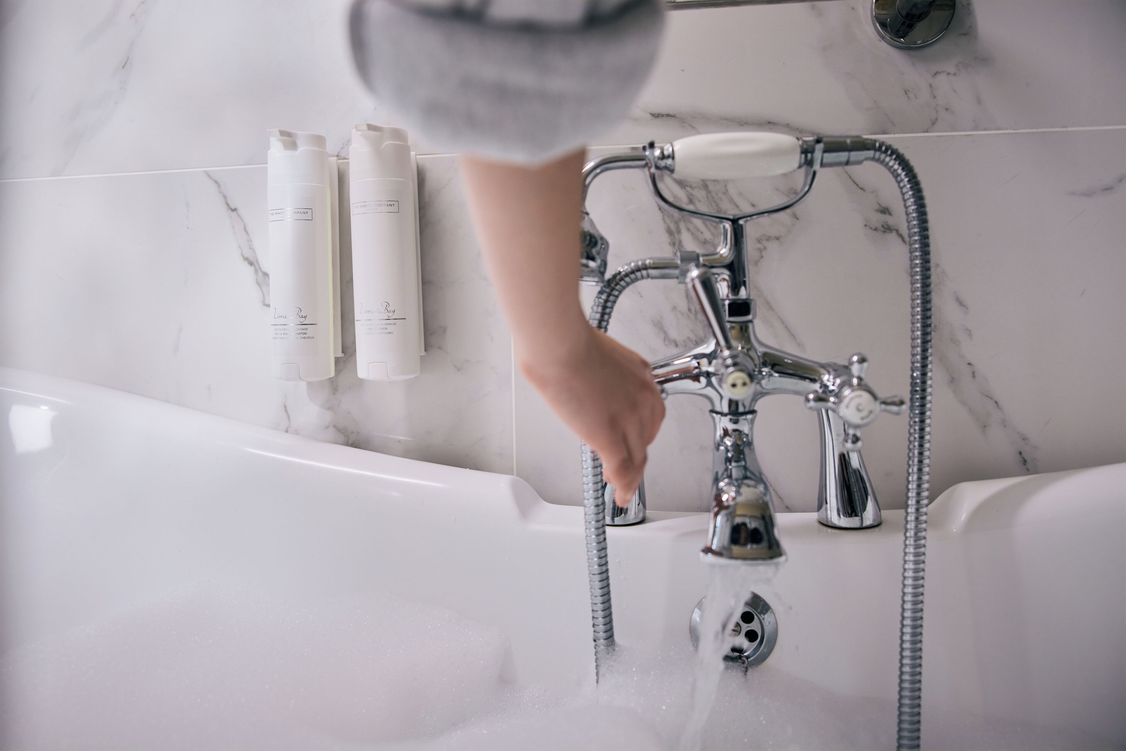 deep-soaking bathtub, designer toiletries, hair dryer, bathrobes