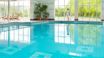Relax by the pool surrounded by lush views and comfortable lounge chairs.