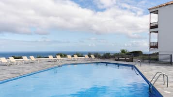 Outdoor pool, open 11:30 AM to 5:30 PM, pool umbrellas, pool loungers