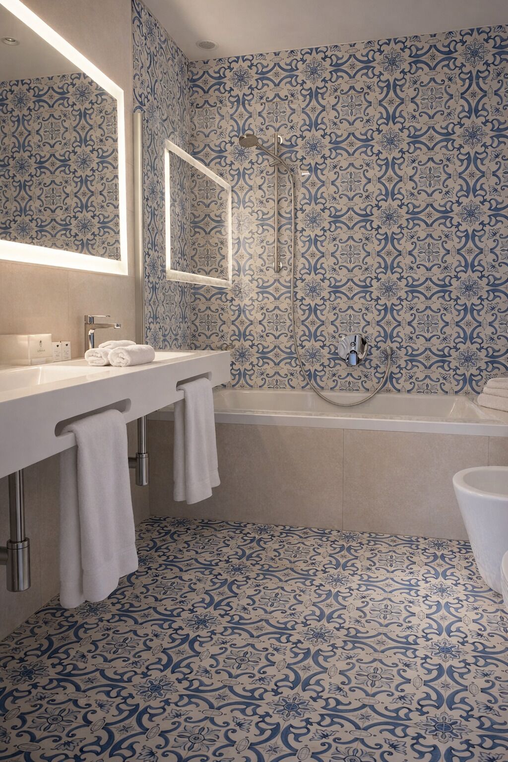 A bathroom with two sinks, a bathtub, and a shower.