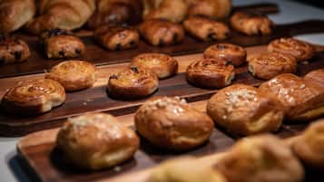 An assortment of baked goods on wooden boards.