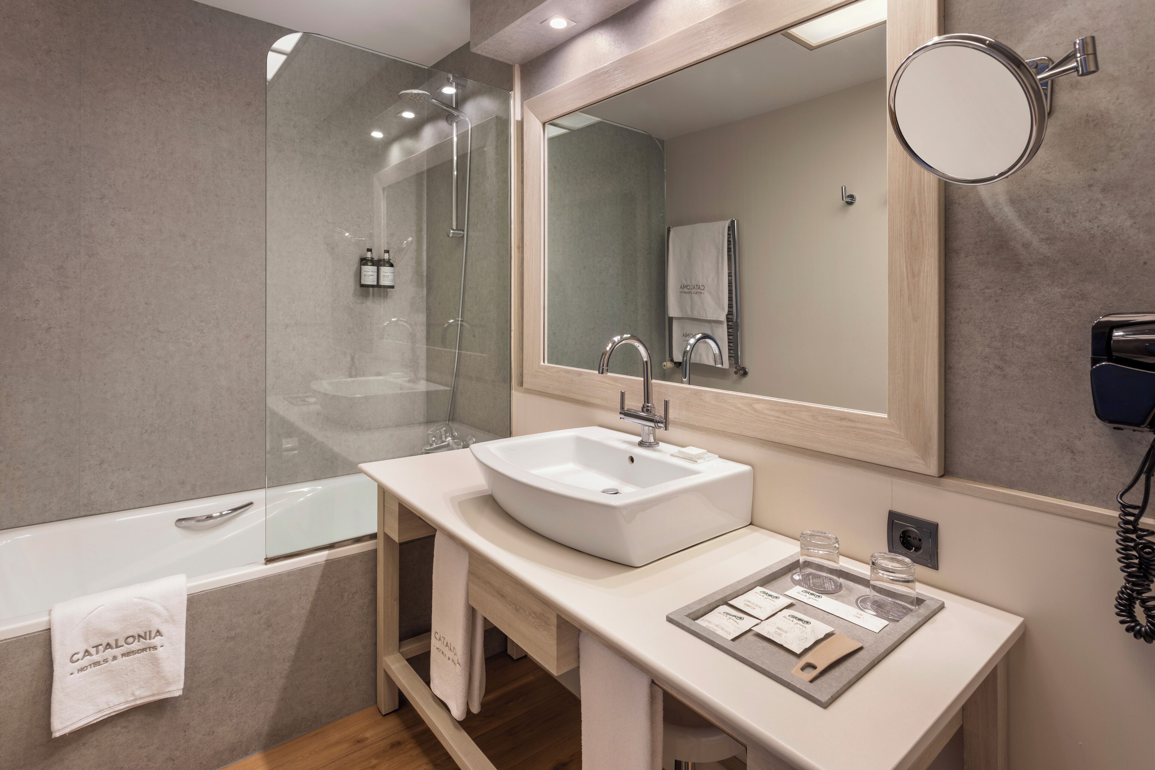 eco-friendly toiletries, hair dryer, towels