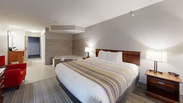 Suite, 1 King Bed, Non Smoking, Jetted Tub | Desk, blackout drapes, iron/ironing board, free cribs/infant beds