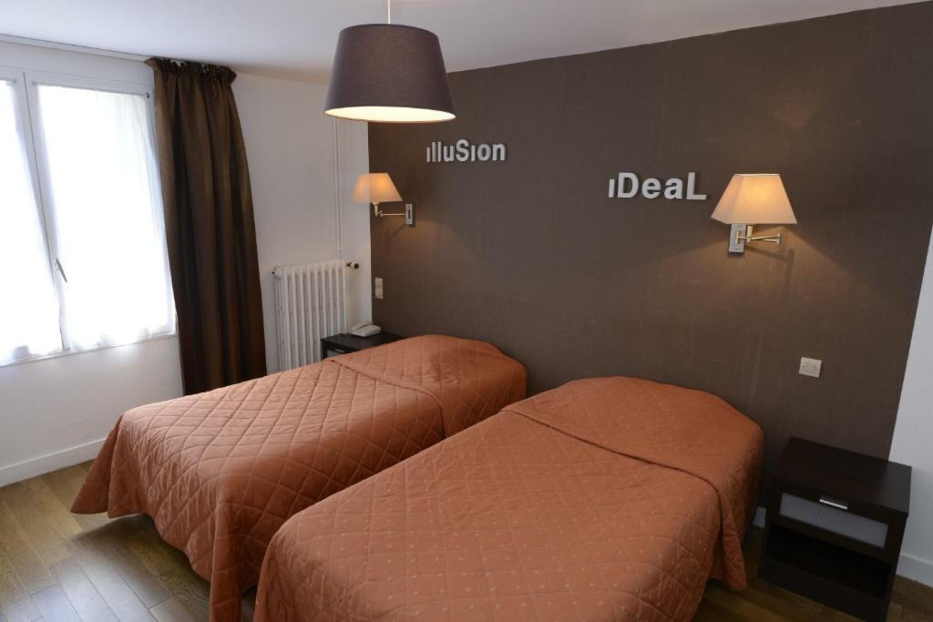 A hotel room with two beds, a dark wall with 'illuSion' and 'iDealL' signage, a window with curtains, and a radiator.