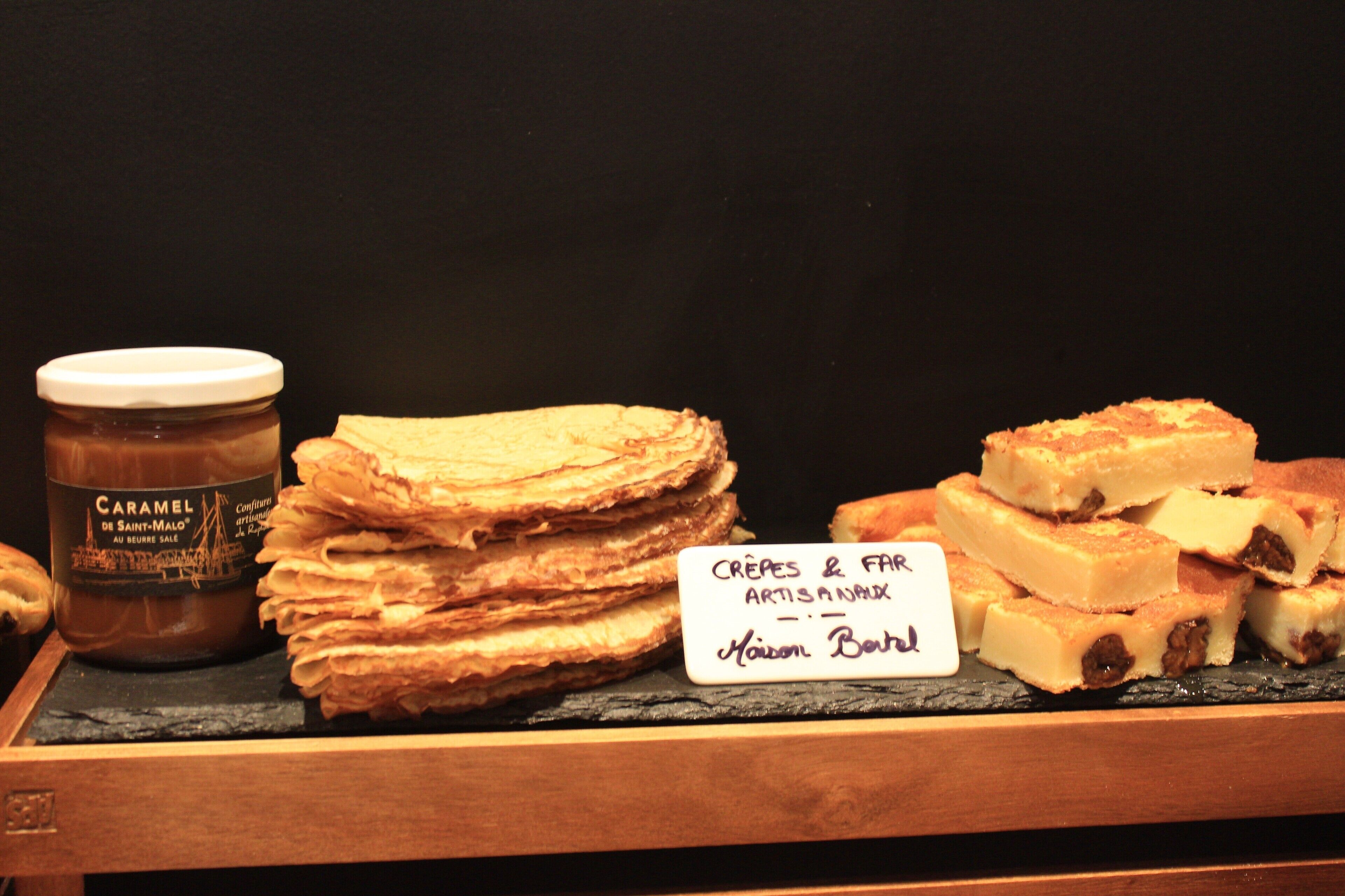 A display of pastries and a jar of caramel.