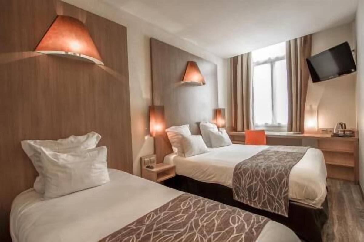 Premium bedding, desk, laptop workspace, blackout drapes