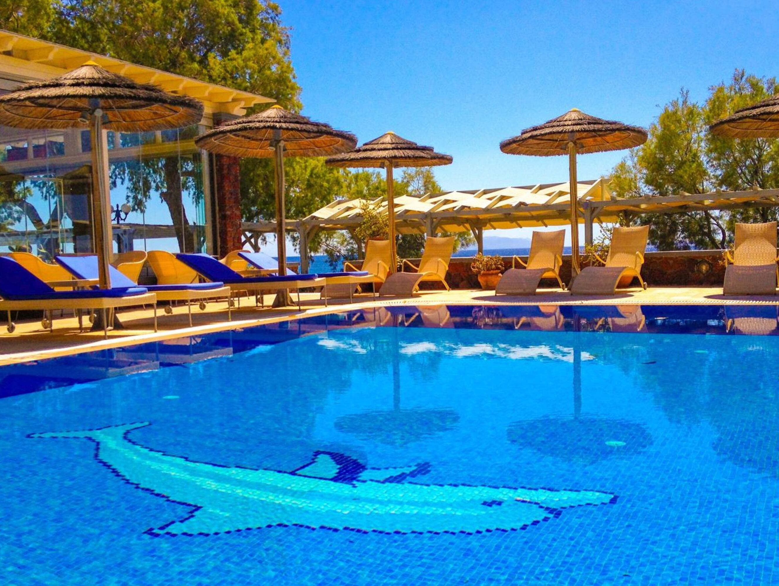 outdoor pool, pool umbrellas, pool loungers